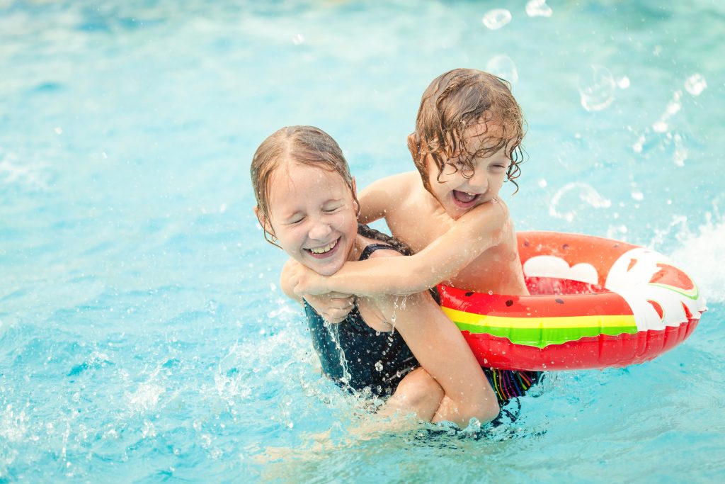 two kids playing in the pool